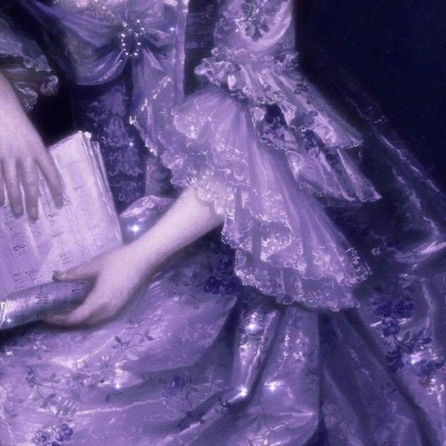 a woman in a purple dress holding a book