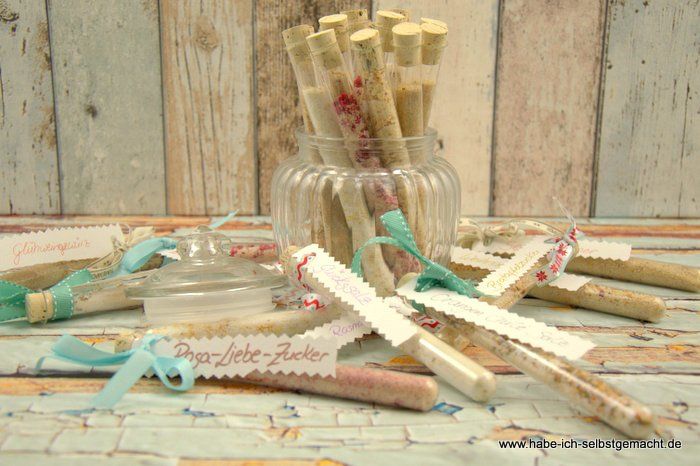 a glass jar filled with lots of different types of sticks