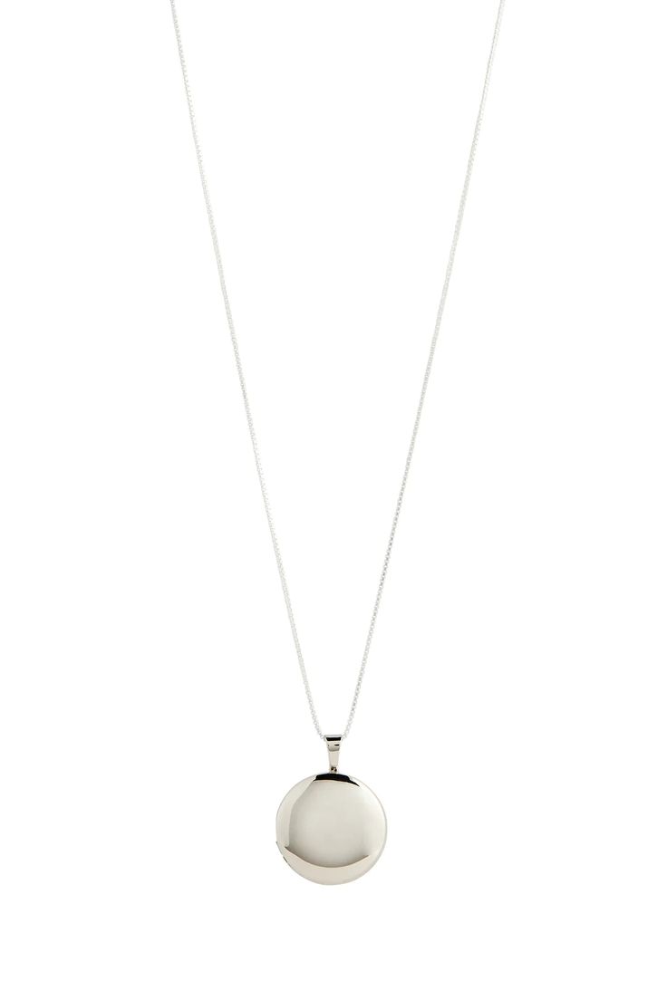 Elegant and and timeless our Classic Locket is a forever piece for the modern sentimental. Featuring a round, slightly convex locket that has a shiny finish hanging from a 1mm 20" Box Chain. 20" Box Chain Stearling silver Classic Silver Pendant Medallion Necklace, Classic Silver Medallion Pendant Necklace, Silver Locket Necklace For Everyday, Classic White Gold Locket Necklaces, Minimalist Sterling Silver Locket Pendant Necklace, Classic Locket Necklace With Polished Finish For Formal Occasions, Classic Pendant Locket Necklace With Adjustable Chain, Classic White Gold Locket Necklace, Silver Round Locket Necklace For Formal Occasion