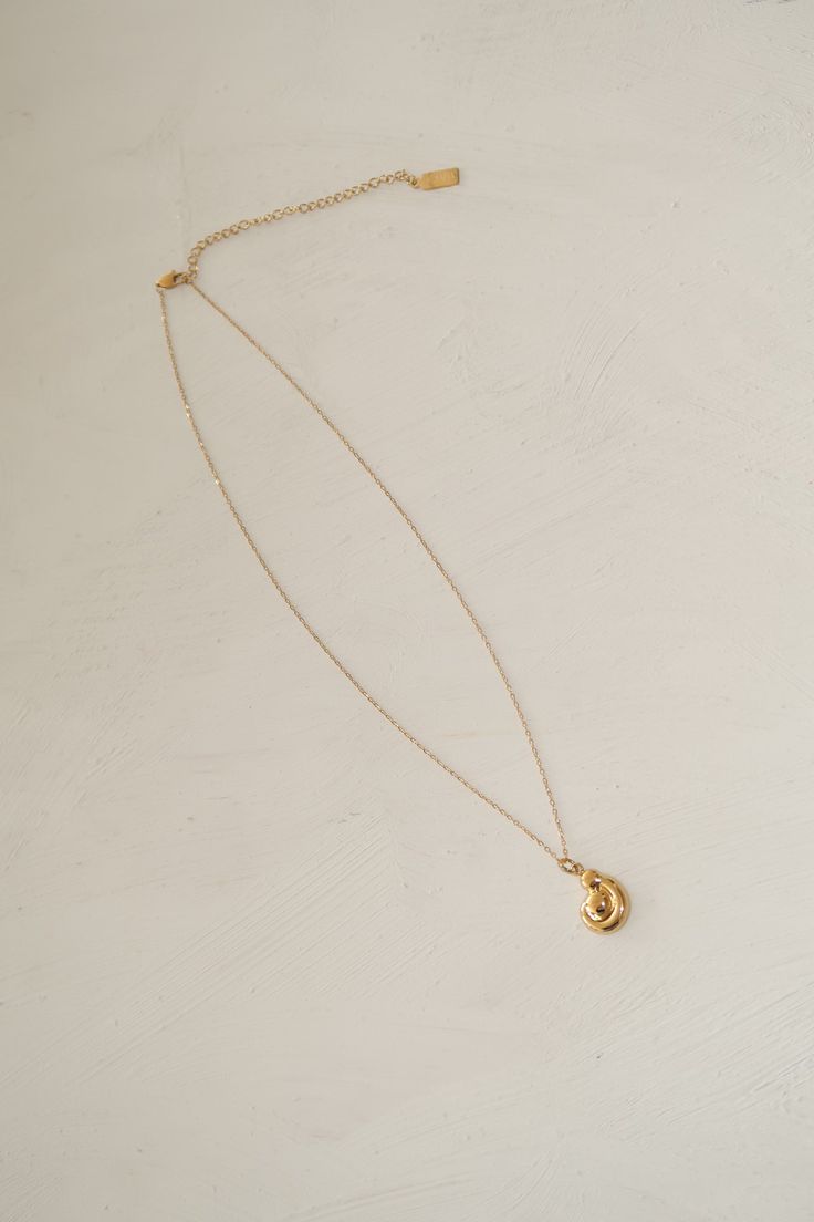 Our cove design on a delicate chain. The perfect classic necklace to add to your summer stack Materials & Specifications pendant size: .5 inch wide chain length: 16inch chain + 3 inch extender Metal Necklace With Delicate Chain And Round Pendant, Minimalist Teardrop Jewelry With Adjustable Chain, Delicate Metal Necklace With Round Pendant, 14k Gold-filled Chain Necklace With Round Pendant, Everyday Pendant Initial Necklace With Delicate Chain, Dainty Pendant Locket Necklace, Minimalist Gold Plated Chain Necklace, Everyday Initial Pendant Necklace With Delicate Chain, Chic Metal Pendant Charm Necklace