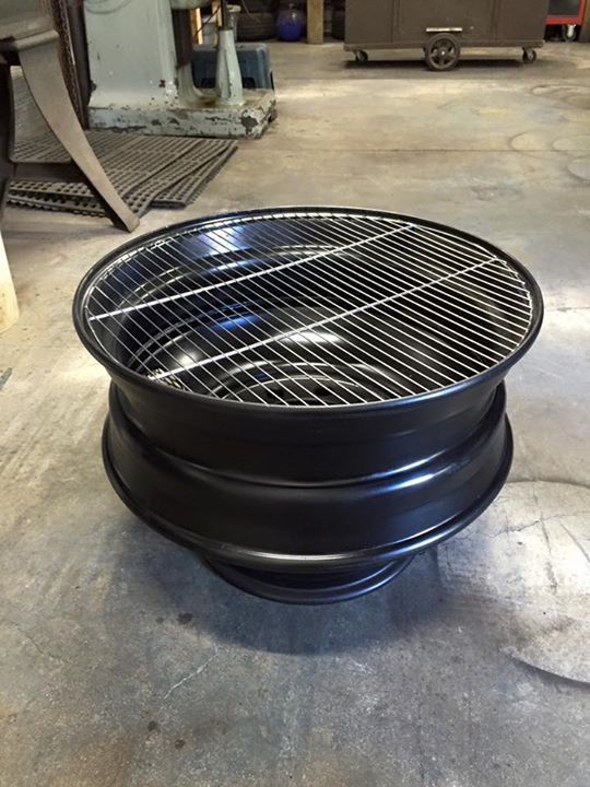 a large grill sitting on top of a cement floor