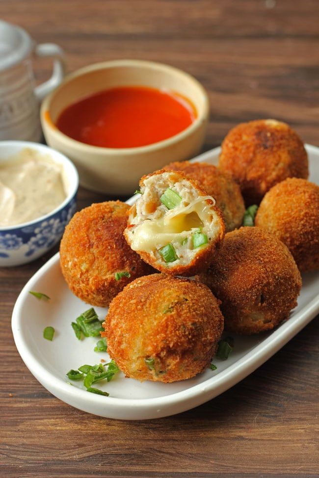 chicken cheese balls on a plate with dipping sauce