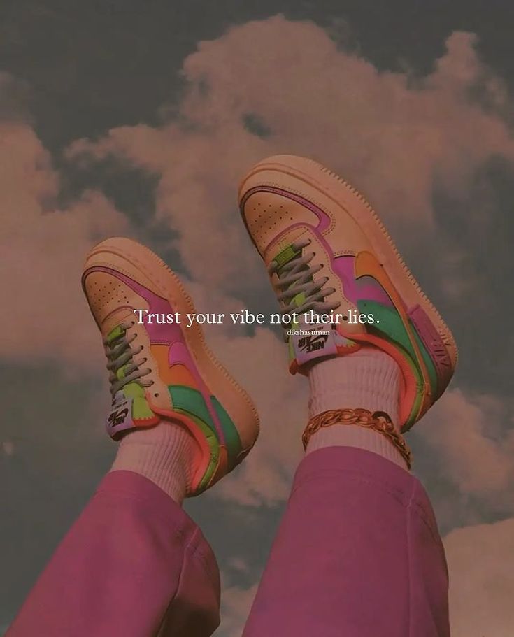 a person wearing pink pants and sneakers with the words trust your vibe not their lies