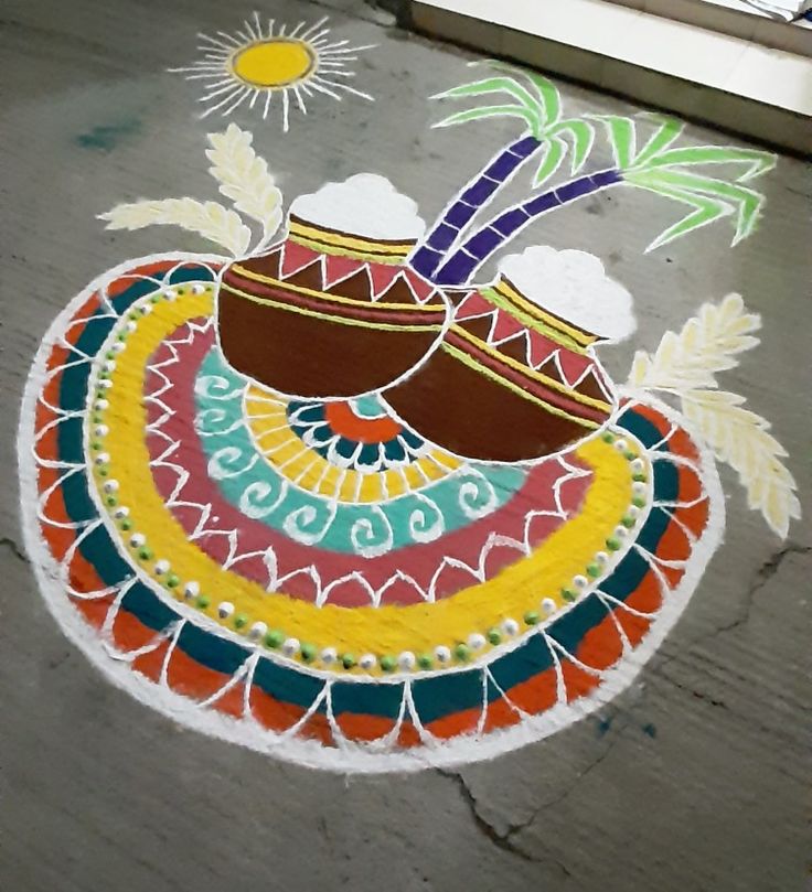 a colorful design on the ground in front of a window with sun and clouds above it