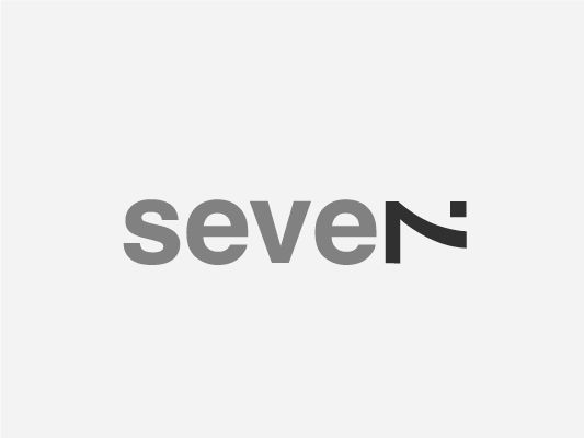 the seven logo is shown in grey and black, with an orange stripe across it