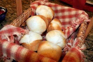 a basket filled with bread sitting on top of a counter