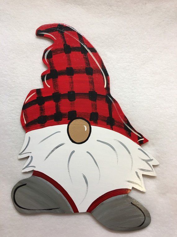 a red and black plaid santa claus mask on a white background with an eye patch