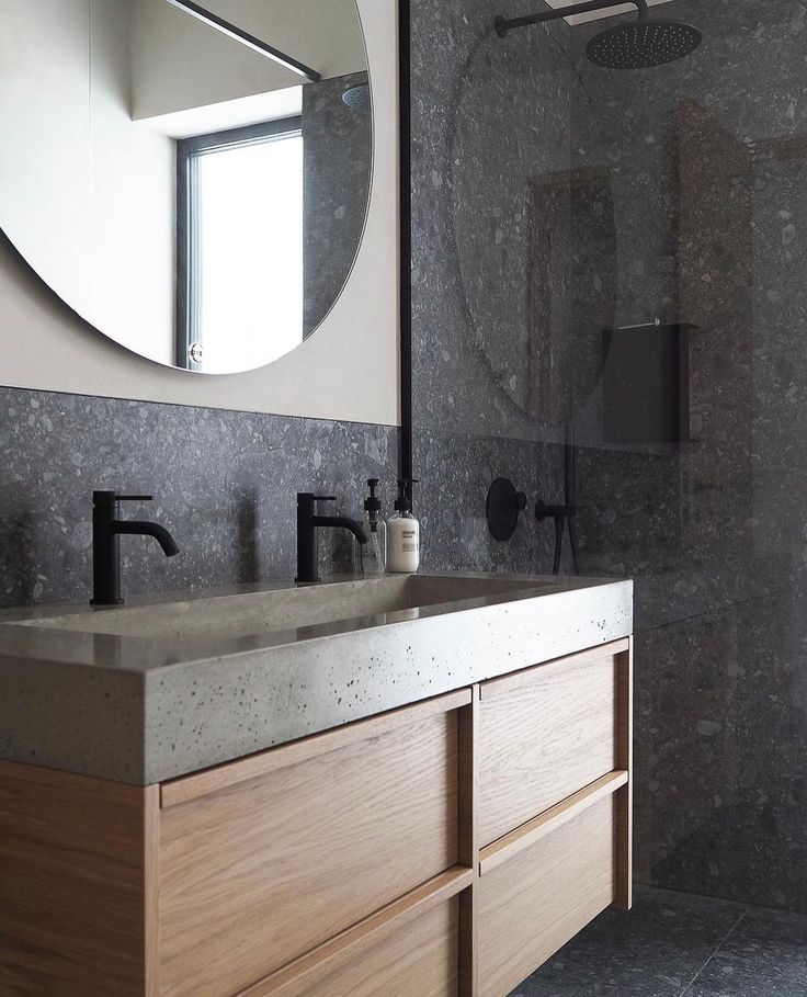 a bathroom with two sinks and a large mirror