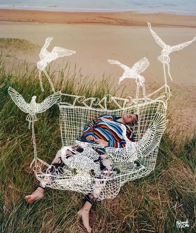 a woman laying in a chair with birds drawn on it