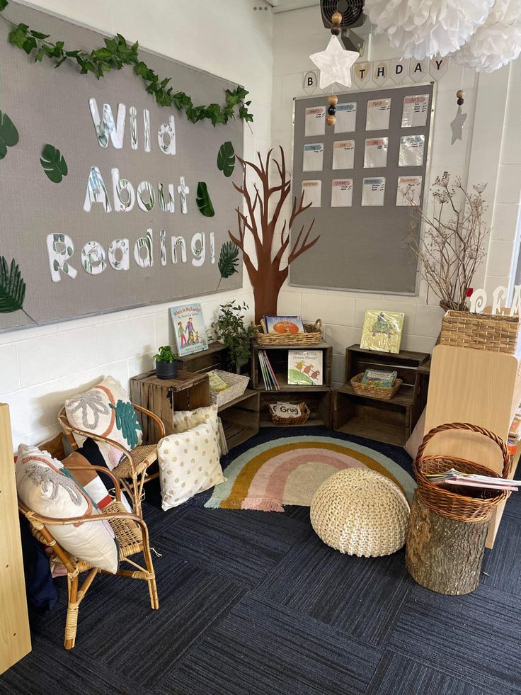 a room with chairs, rugs and pictures on the wall