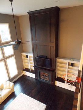 an overhead view of a living room with a basketball hoop in the corner and a wood burning stove