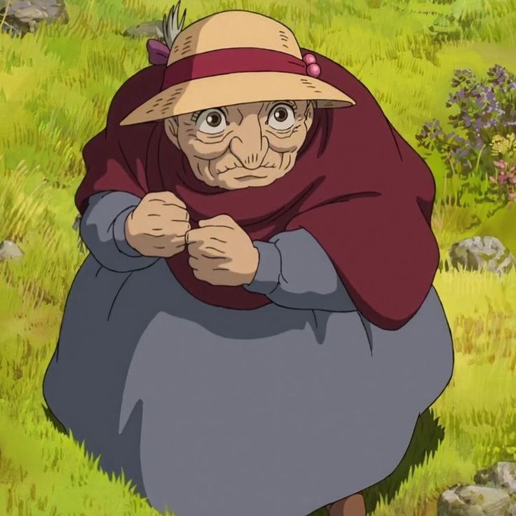 an old woman in a hat and dress standing in the grass with her hands on her hips