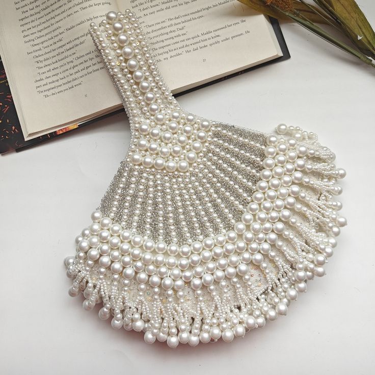 Luxury Statement Pearl Beaded Handbag Wedding Wristlet Handheld Beaded Evening Bag For Wedding, Elegant Evening Wristlet Pouch, Traditional White Evening Bag With Pearl Handle, Elegant Evening Clutch Wristlet, Elegant Clutch Wristlet As Gift, Elegant Clutch Wristlet For Gift, Elegant Party Wristlet Pouch, Elegant Party Pouch Wristlet, Elegant Formal Pouch Wristlet