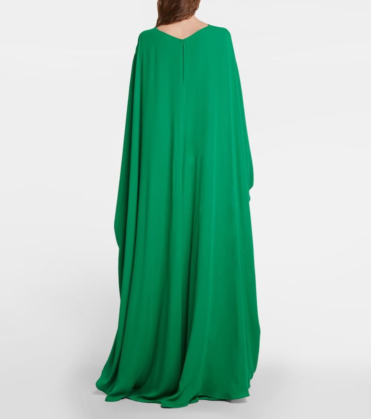 Caped Cady Couture Gown in Green - Valentino | Mytheresa Long Sleeve Pre-draped Maxi Dress For Wedding, Pre-draped Long Sleeve Wedding Gown, Pre-draped Gown With Cape Sleeves, Luxury Floor-length Evening Dress With Draped Sleeves, Floor-length Gown With Draped Sleeves For Evening, Green Pre-draped Maxi Dress, Formal Gown With Draped Long Sleeves, Green Pre-draped Evening Gown, Luxury Long Sleeve Silk Gown