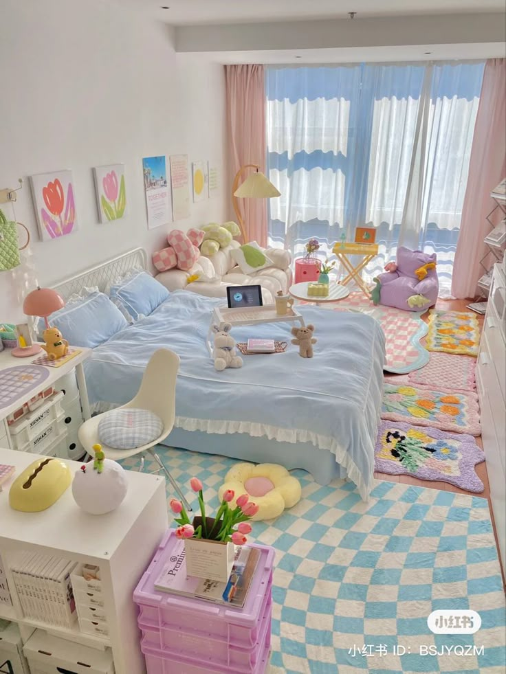 a living room filled with lots of furniture next to a bed and desk in front of a window