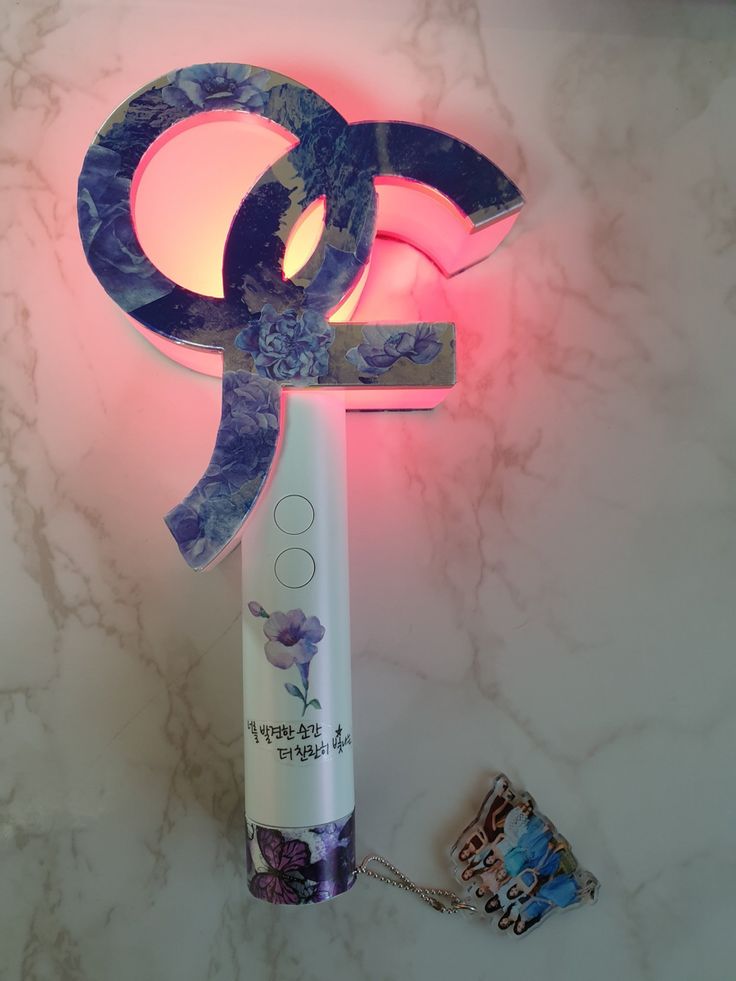 a tube of toothpaste next to an illuminated object