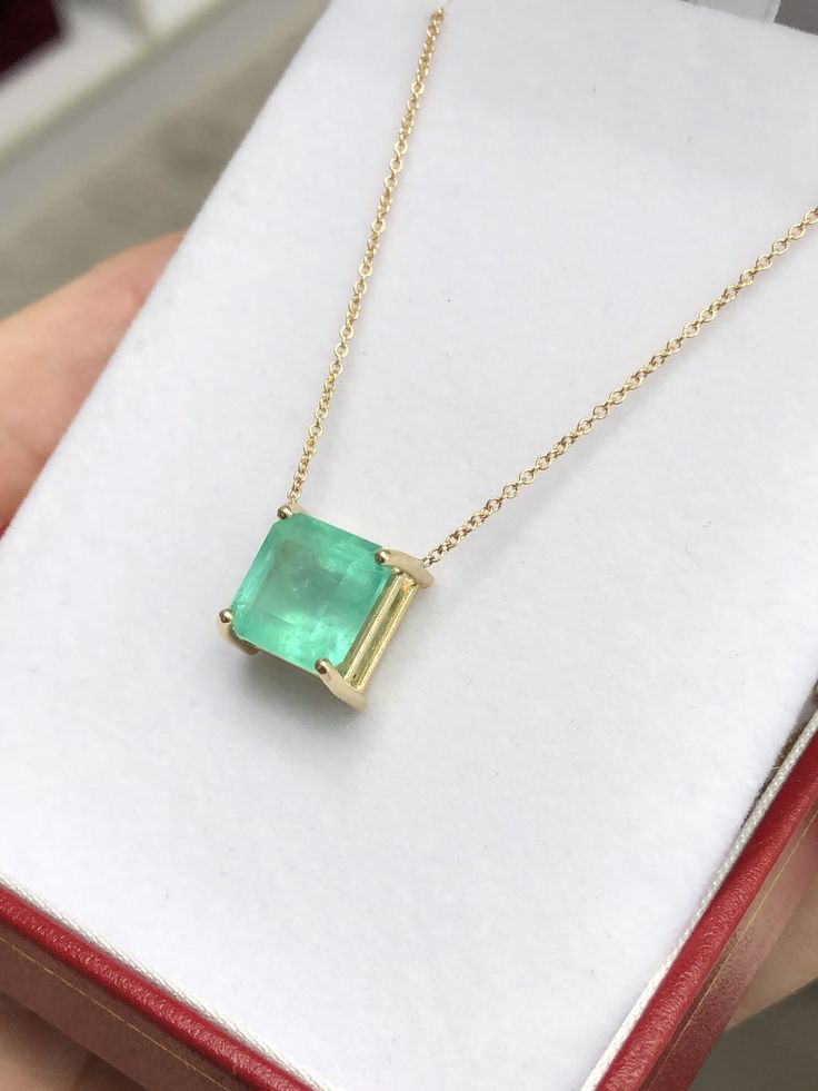 Featured here is a 4.63-carat stunning, Colombian emerald necklace in fine 14K yellow gold. Displayed in the center is a bluish-green emerald with very good clarity, minor flaws are visible to the eye as no emerald is perfect. Accented by a simple four-prong gold mount, allowing for the emerald to be shown in full view. The earth mined, green Colombian emerald has a desirable lush green color with excellent qualities. An 18 inch is attached to the emerald pendant. This necklace is ideal for ever Luxury Yellow Gold Emerald Necklace With Prong Setting, Luxury Emerald Necklace With Prong Setting, 14k Gold Emerald Cut Fine Jewelry Necklace, Luxury Green Necklace With Prong Setting, Classic Yellow Gold Emerald Cut Necklace, Fine Jewelry Yellow Gold Necklace Aaa Quality, Classic Yellow Gold Emerald Necklace For May Birthstone, Exquisite Emerald Necklace For Formal Occasions - May Birthstone, Exquisite Emerald Necklace For Formal Occasions And May Birthstone