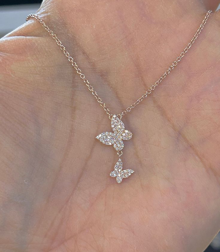 "Beautiful 2 butterfly diamond necklace set in solid 14K Gold. Perfect necklace to wear with everything. Give this good luck gift for any occasion. Lays nicely on the neck, won't flip around. The diamonds are all full cut round brilliants and it sparkles a lot. Our diamonds are not \"single cut\" but all full cut brilliant diamonds. There's a difference in the sparkles. The butterfly is 20.5mm. The white gold chain can be worn at 18\", 17\", or 16\" lengths. Genuine Round Brilliant Cut Diamonds Butterfly Diamond Necklace, Diamond Jewelry With Butterfly Charm For Formal Occasions, Butterfly Shaped Diamond Necklace As Gift, Formal Diamond Jewelry With Butterfly Charm, Diamond Jewelry With Butterfly Charm For Anniversary, Diamond Butterfly Jewelry For Anniversary, Butterfly Diamond Necklace For Gift, Butterfly Diamond Necklace For Anniversary, Diamond Butterfly Necklace For Anniversary