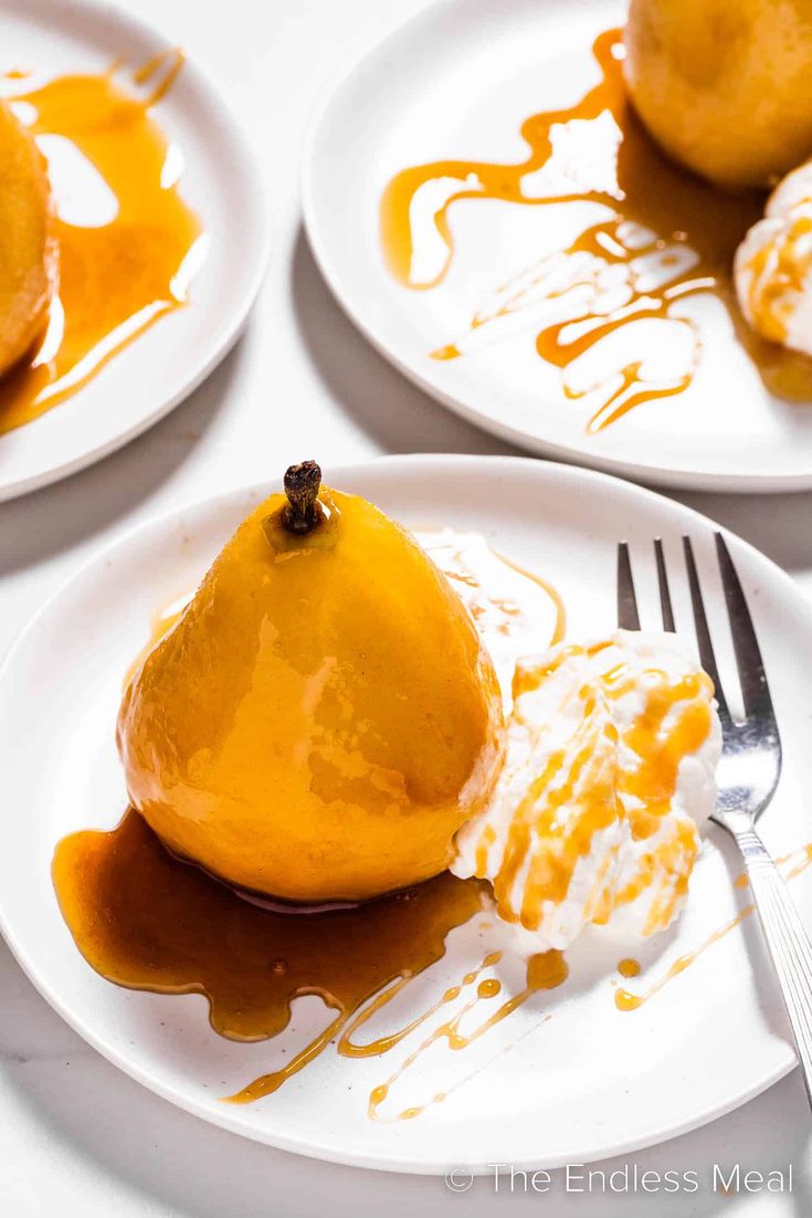 three plates topped with pears covered in caramel sauce and drizzled with icing