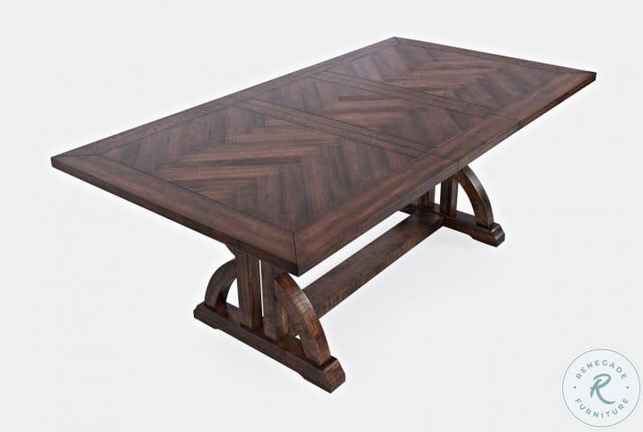 a wooden table sitting on top of a white floor