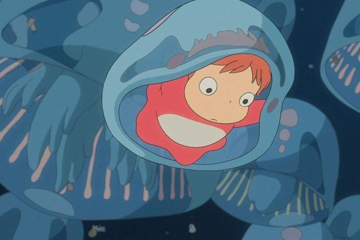 an animated image of a boy peeking out from under some blue fish in the ocean