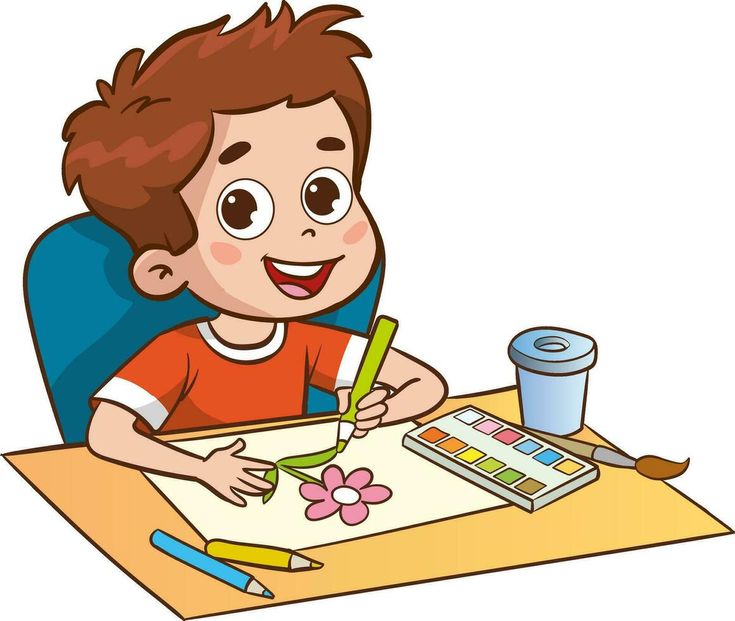 a little boy sitting at a desk with a pen and paper