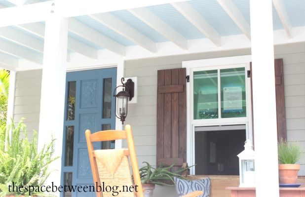 a chair sitting on the front porch of a house