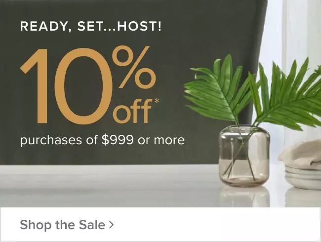 a plant in a vase next to a sign that says ready, set, host 10 % off purchases of $ 999 or more