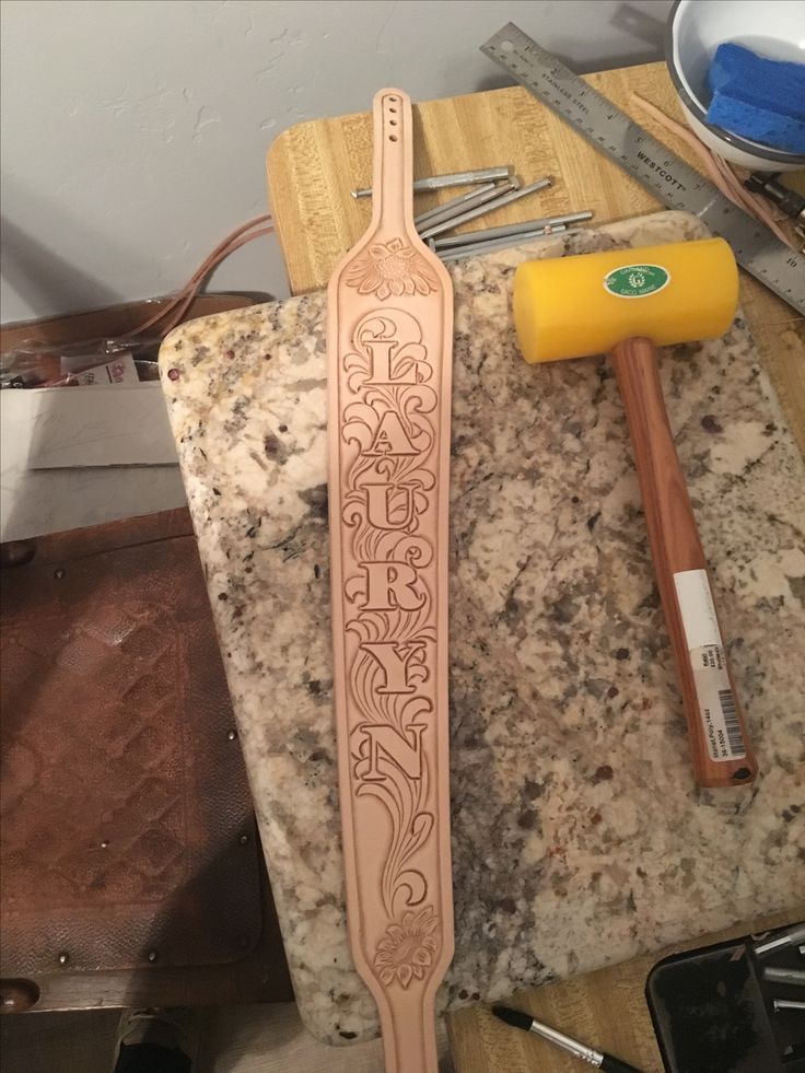 a wooden carving tool sitting on top of a counter