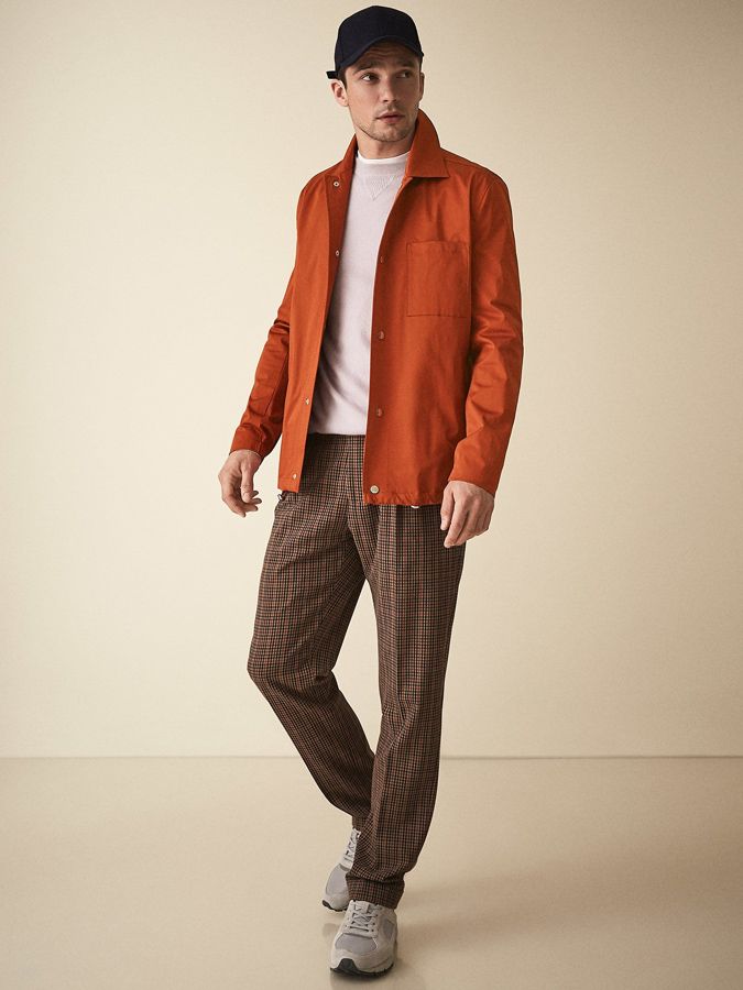 The Lightweight Autumn Layer You've Ignored For Too Long #clothing #outerwear #jacket #orange #fashion #brown #suit #gentleman #standing #blazer Orange Button Down Shirt Outfit, Orange Jacket Outfit Men, Orange Men Outfit, Orange Shirt Outfit Men, Brown And Orange Outfit, Man Outfit, Brown Suit, Coach Jackets, Retro Sportswear