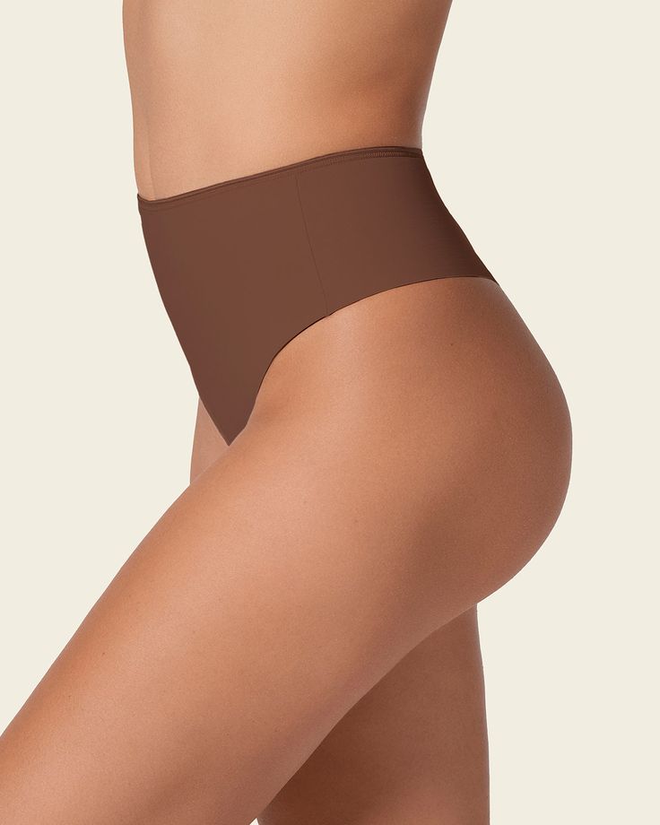 Minimalistic style meets effective shaping! This innovative shaper panty is made of our trademark DuraFit® fabric, double-layered in the front for firm compression to flatten the tummy, single-layered in the back for a comfortable fit. It's high-waisted with high sides for shaping coverage. The thong-style back provides a totally invisible look under clothes. Its minimal coverage also serves to not flatten the cheeks, instead lifting and separating. If you're a thong lover, this seamless shaper Shaper Panty, Compression Garment, Leg Bands, Legging Sport, Minimalistic Style, Sports Leggings, Sport Running, Sheer Lace, Workout Pants