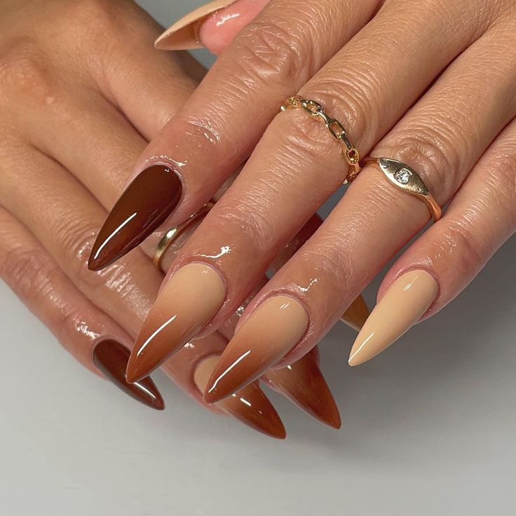 a woman's hands with long, shiny nails