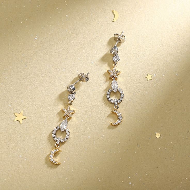 Adorn yourself in these exquisite Moon Star Pearl Earrings, perfect for any dinner party. Crafted of luxurious brass, these earrings showcase a sparkling star surrounded by a breathtakingly beautiful pearl. With luxurious style, these earrings also make a thoughtful and memorable gift. DETAILS Plating: 18K Gold Materials: 18K Gold on Brass, Zircon Size: 1.81 "*0.39"(4.6cm*1.0cm) Weight: 3.82g/pr Elegant Gold Star-shaped Crystal Earrings, Elegant Gold Star Shaped Crystal Earrings, Elegant Moon-shaped Party Jewelry, Celestial Silver Sparkling Earrings, Elegant Gold Star Earrings, Elegant Star-shaped Sparkling Earrings, Moon-shaped Pierced Earrings For Party, Celestial Silver Crystal Earrings For Party, Moon Shaped Pierced Earrings For Party