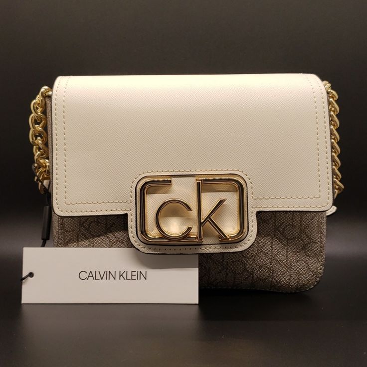 Nwt Ck Cherub White Shoulder/Crossbody Bag Beige Top Handle Shoulder Bag With Logo, Luxury Cream Shoulder Bag With Logo, Chic Crossbody Shoulder Bag With Logo, Designer Beige Shoulder Bag With Logo, Luxury Cream Bags With Logo, Elegant Crossbody Bag With Logo, Designer Cream Shoulder Bag With Logo, Chic Logo Rectangular Shoulder Bag, Beige Logo Crossbody Shoulder Bag