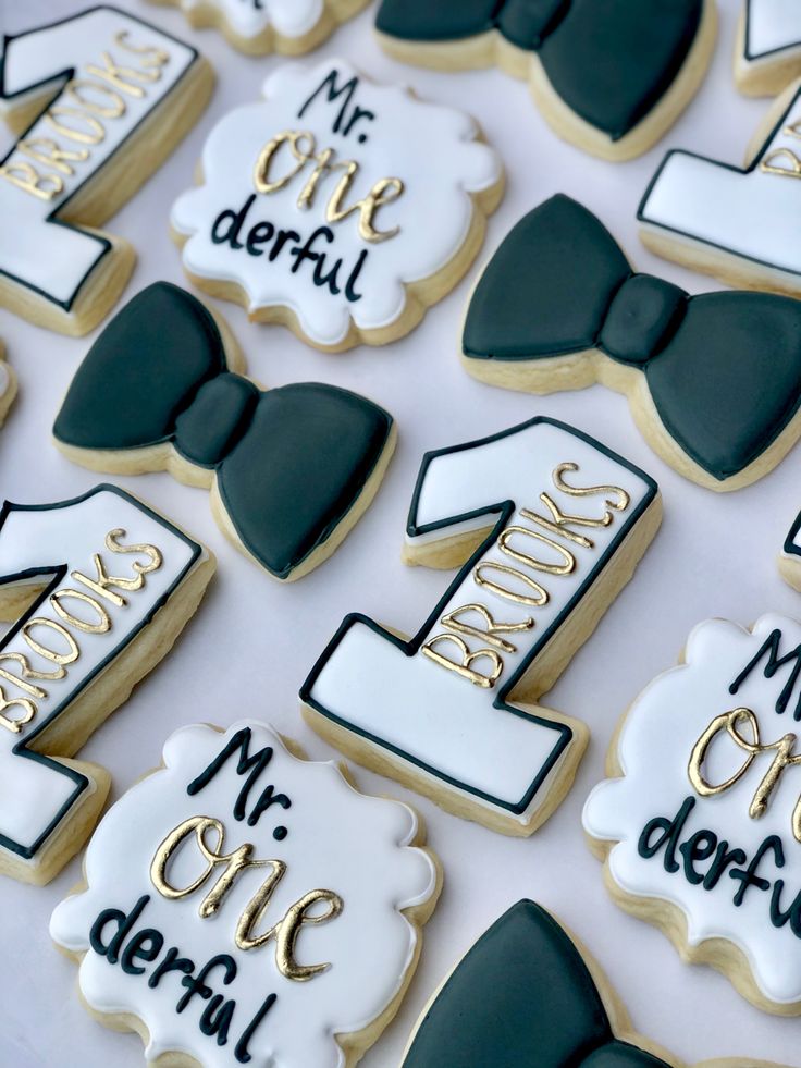 decorated cookies are arranged on a table