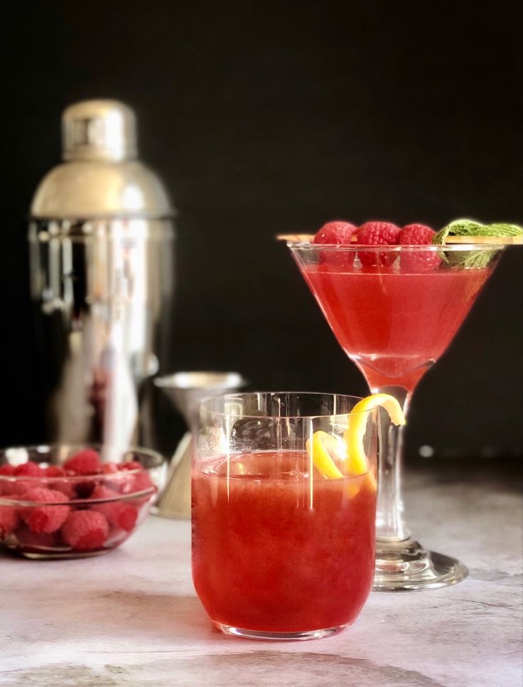 two cocktail glasses filled with raspberry lemonade