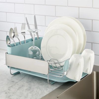 a dish rack with plates and silverware in it