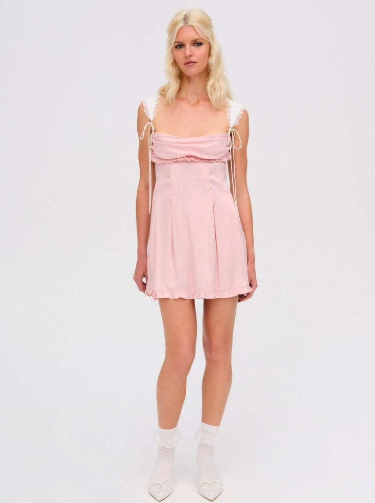 Short and oh-so-sweet, the Holland pink mini dress is designed for the modern dreamer. Crafted in a satin jacquard, this simple yet ultra-feminine pink dress features contrast ruffle trim shoulder straps and a charming cowl neckline. Inspired by vintage dresses, it's the perfect piece for every occasion. Mini Dress Pink, Pink Mini Dress, Ultra Feminine, Cowl Neckline, Pink Mini, Pink Mini Dresses, Ruffle Trim, Pink Dress, Shoulder Straps