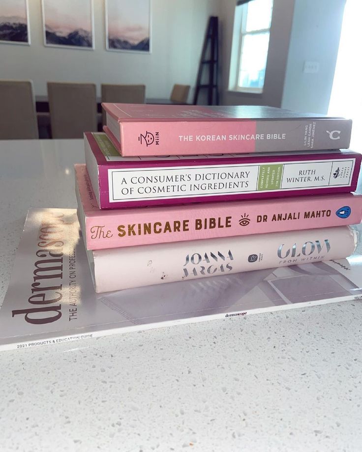 a stack of books sitting on top of a table