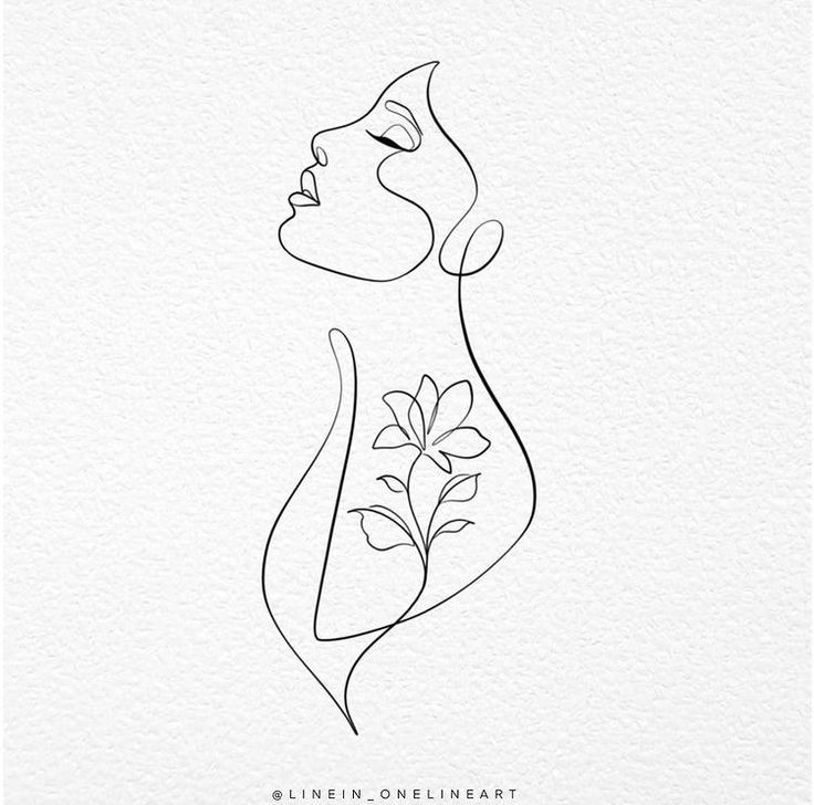 a line drawing of a woman's face with leaves on it