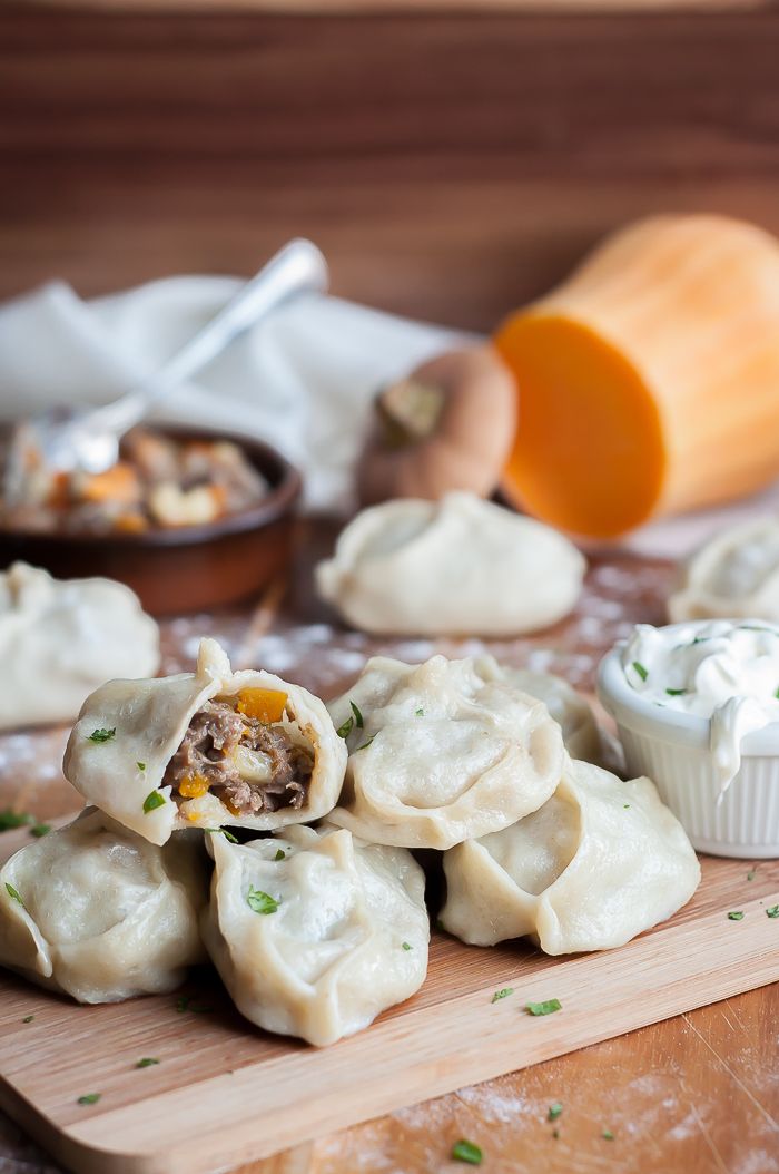 some dumplings are sitting on a cutting board