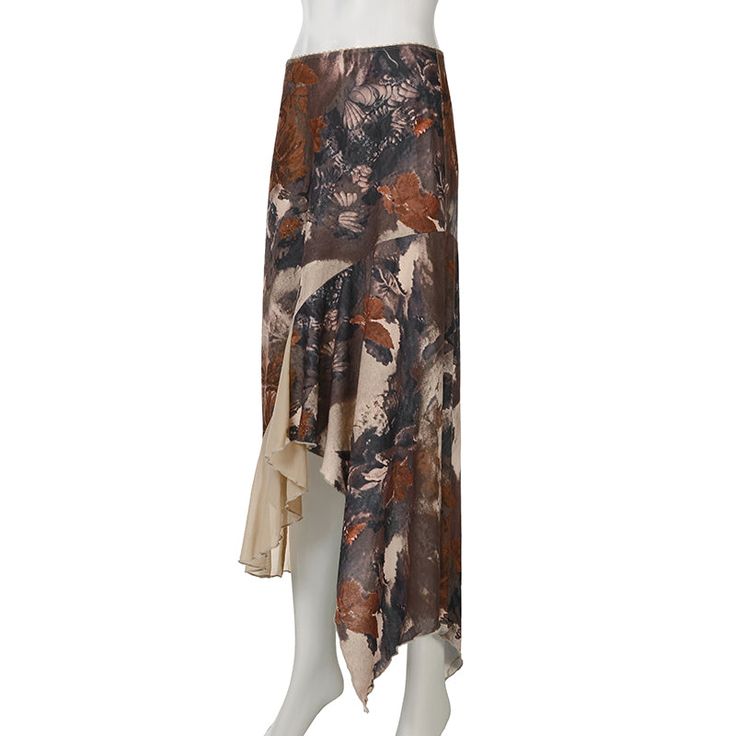 Zanya Asymmetric Maxi Skirt in Brown The Zanya Asymmetrical Hem Floral Midi Skirt is a unique blend of natural elegance and contemporary style. With its intricate floral print and flowing asymmetrical hem, this skirt offers a distinctive look that stands out in any setting. The earthy tones and delicate layers create a sophisticated and graceful silhouette, making it a perfect choice for both casual outings and special occasions. Details: - Intricate floral print for a naturally elegant look- As Beige Asymmetrical Flowy Maxi Skirt, Summer Asymmetrical Maxi Skirt With Lining, Asymmetrical Lined Maxi Skirt For Summer, Beige Flowy Asymmetrical Maxi Skirt, Flowy Asymmetrical Beige Maxi Skirt, Chic Asymmetrical Floral Print Maxi Skirt, Chic Asymmetrical Floral Maxi Skirt, Bohemian Beige Asymmetrical Skirt, Bohemian Style Beige Asymmetrical Skirt