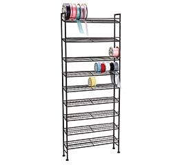 a metal shelf with several shelves and cups on top of it, all stacked up against the wall