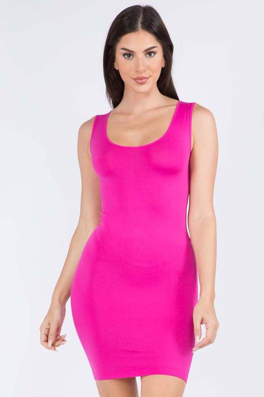 Women's Solid Seamless Traditional Tank Slip Dress.- Round Neckline- Sleeveless- Long Camisole- Mini Dress- Body Contouring- Figure Hugging- Solid Color- Comfortable- Super Soft- Stretchy- One Size Fits Most 0-14- One size Fits Most Plus 16-22- Approximately 28" L- 92% Nylon, 8% Spandex Solid Color Seamless Sleeveless Mini Dress, Seamless Solid Sleeveless Mini Dress, Sleeveless Stretch Seamless Dress, Seamless Stretch Sleeveless Mini Dress, Sleeveless Seamless Mini Dress, Sleeveless Seamless Mini Dress For Spring, Seamless Stretch Scoop Neck Dresses, Pink Stretch Scoop Neck Dress, Casual Slip Dress