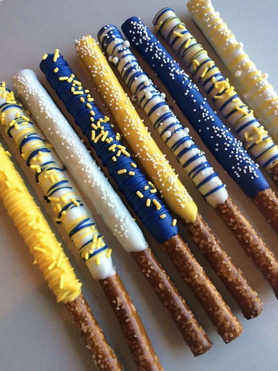 several different types of pastry sticks are lined up in a row on a white surface