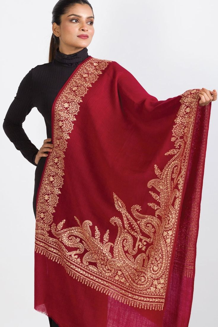 Our Geeta Embroidered Shawl features exquisite embroidery on soft 100% merino wool. With a stunning contemporary design, this classically beautiful shawl showcases the intricate embroidery traditions of Northern India in a range of jewel tones.  The high quality and elegance of our embroidered shawls make them treasures that will last for generations.  -------------------------------- Material: 100% Merino Wool Shape: Rectangle Care: Hand Wash with Gentle Detergent, Hang to Dry Dimensions: 28" x Luxury Handloom Traditional Drape Shawl, Luxury Traditional Shawl Scarf, Luxury Elegant Shawl With Intricate Embroidery, Luxury Jamawar Pashmina Shawl For Traditional Ceremonies, Luxury Elegant Embroidered Pashmina Fabric, Luxury Dupatta Shawl With Motifs, Luxury Semi-stitched Handloom Shawl, Luxury Handmade Shawl For Gift, Elegant Unstitched Shawl For Eid