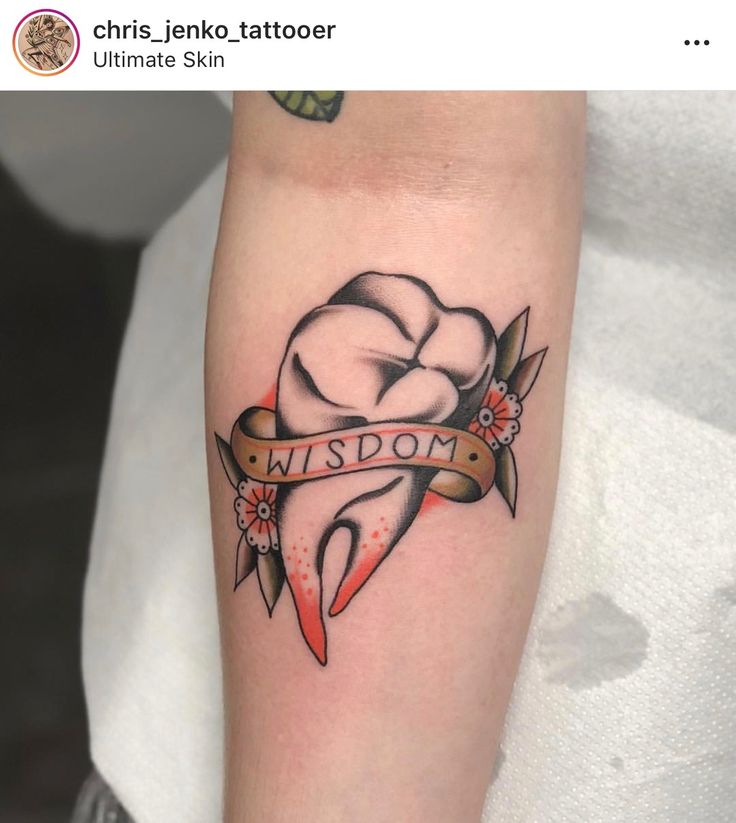 a tattoo on the arm of a woman with a ribbon around her neck that says, i'm sorry