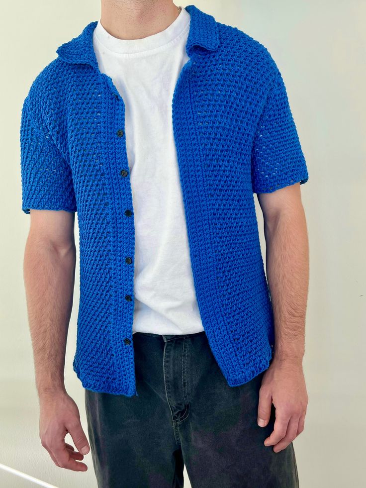 Elevate your wardrobe with the Kent Top Crochet Pattern, a classic men's crochet button-down top.The pattern is written in US crochet terminology. Top uses fingering/sock weight yarn. The printable PDF includes details of materials, abbreviations, gauge/sizing when applicable, and detailed instructions for crochet and assembly. PDF is in English only. Men's Crochet Sweater, Crochet Shirt Free Pattern, Button Down Pattern, Crochet Shirt Pattern, Romper Men, Crochet Terminology, Crochet Sweater Pattern, Top Crochet Pattern, Crochet Button