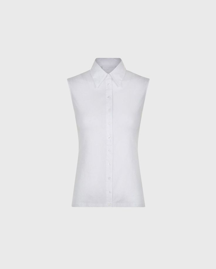 The NUAGE is a sleeveless pima jersey blouse with pima jersey collar, swallow cuffs, and button placket. Classic Cotton Vest Top, Classic Sleeveless Top For Daywear, White Formal Sleeveless Top, Classic Fitted Sleeveless Blouse, Classic Summer Vest Tops, Classic White Tank Top For Daywear, Classic Sleeveless Summer Shirt, Elegant Sleeveless Shirt For Workwear, Classic Sleeveless Tank Top For Daywear