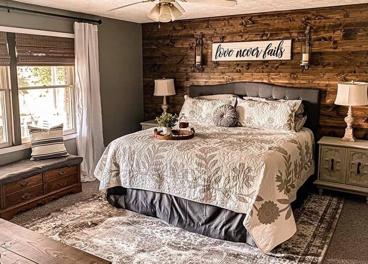 a bed sitting in a bedroom next to a window with a wooden wall behind it